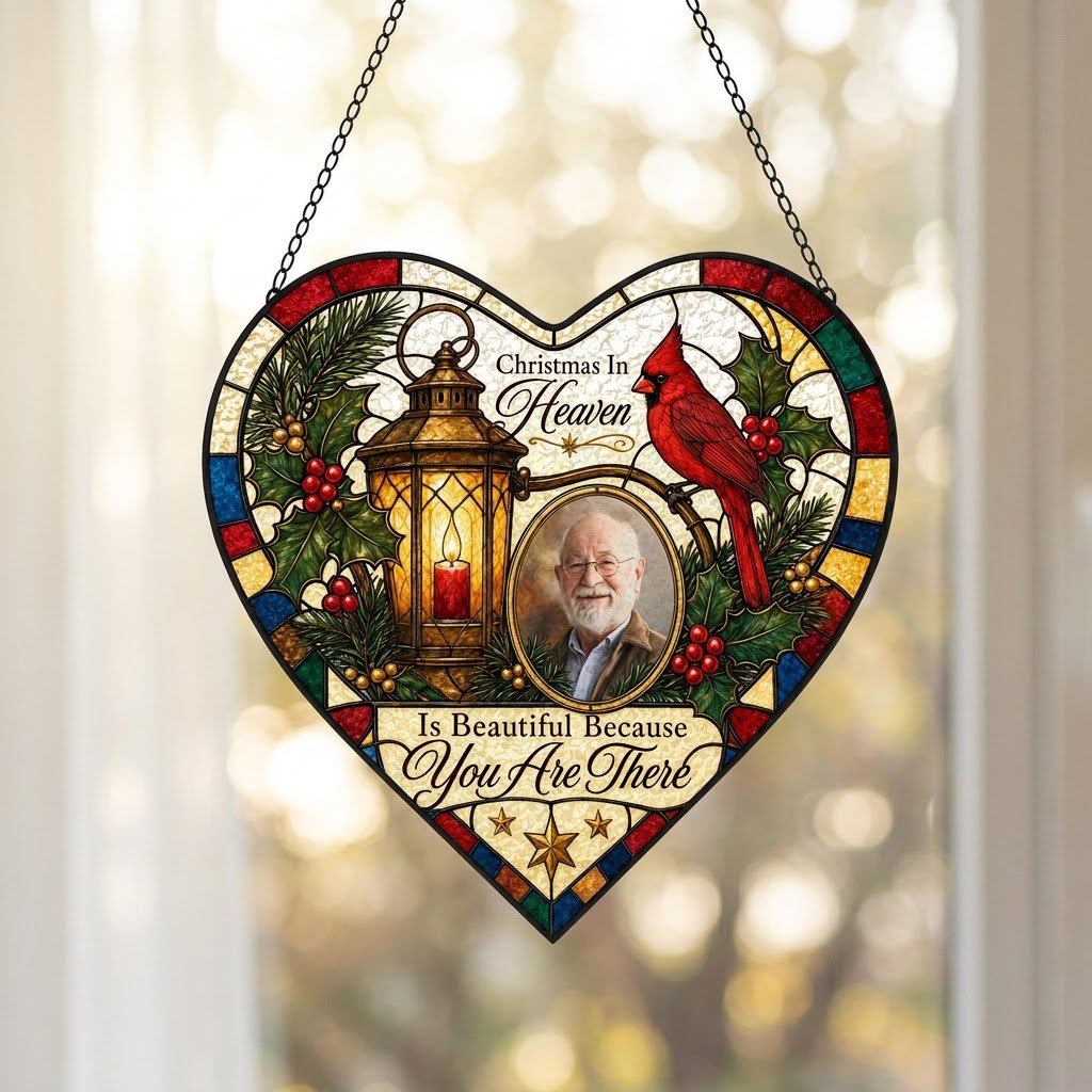 Heart stained glass suncatcher with lantern, red candle, red cardinal, holly, pine, and an oval photo frame.