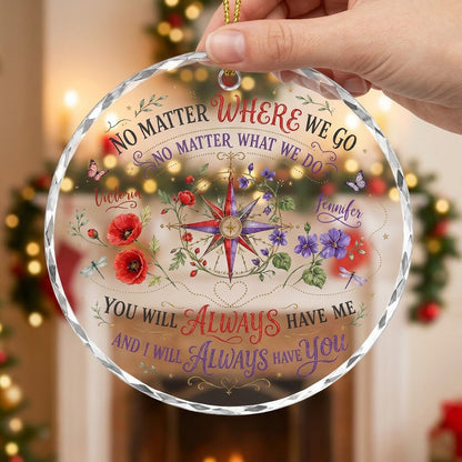 Round glass ornament with a compass rose, red and purple flowers, butterflies, dragonflies, and long-distance quotes.