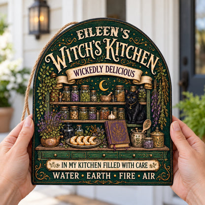 Arch wooden sign with black cat, apothecary jars, lavender, crescent moon and stars, and the text WITCH'S KITCHEN.
