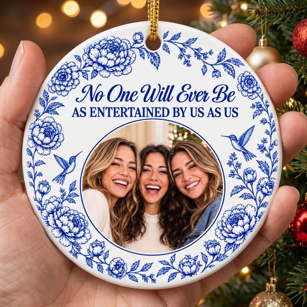 Round white ceramic ornament with blue floral border, two hummingbirds and a central circular photo frame with friends.