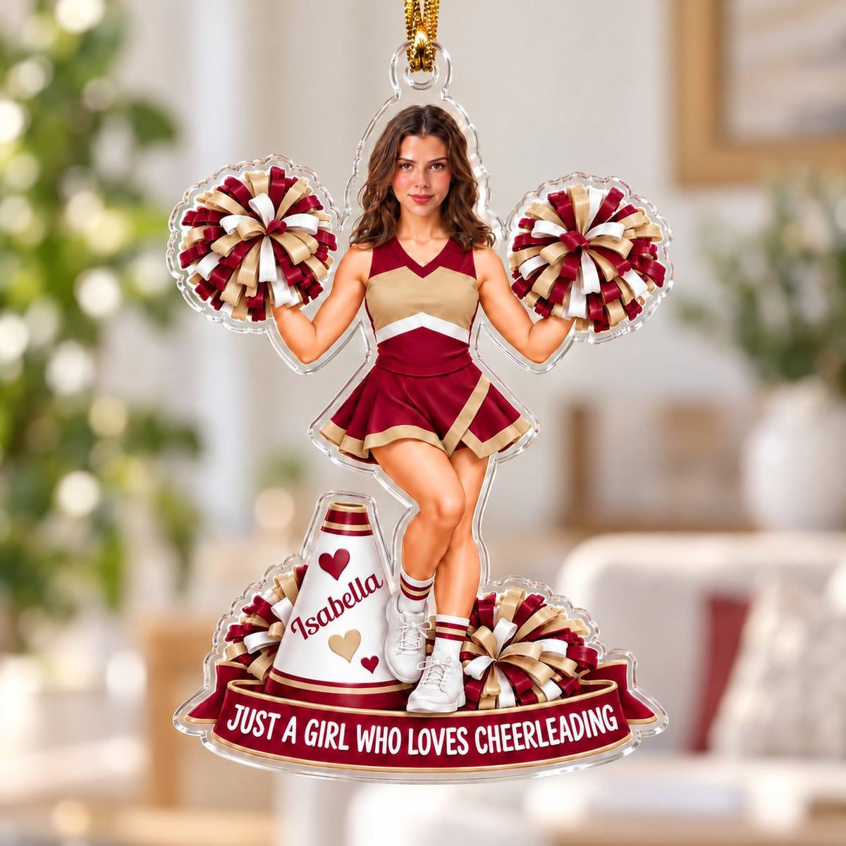 Custom-cut acrylic ornament of a maroon-and-gold cheerleader with pom-poms, megaphone, and a name banner.
