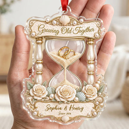 Acrylic hourglass ornament with gold rings, roses, seashells, pearls, and Growing Old Together text.