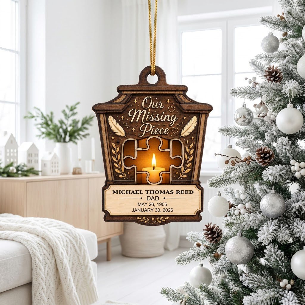 Wood ornament with lantern-style frame, puzzle-piece cutout revealing candle glow, “Our Missing Piece” text and feather 