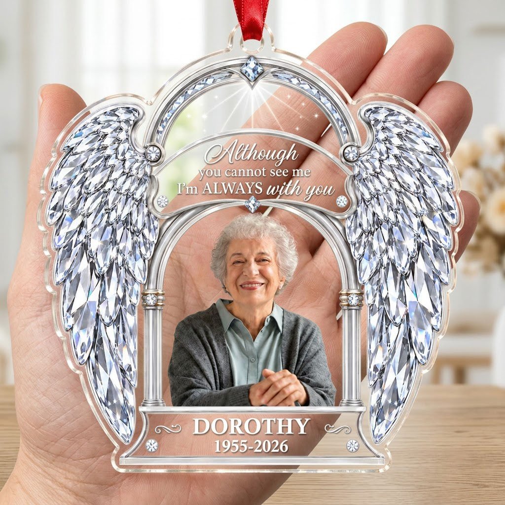 Acrylic memorial ornament with crystal angel wings, arched photo frame and wood-grain name and date banners.