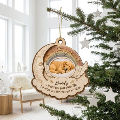Wood ornament with crescent moon, angel wings, rainbow, and a sleeping dog photo above a cloud plaque.