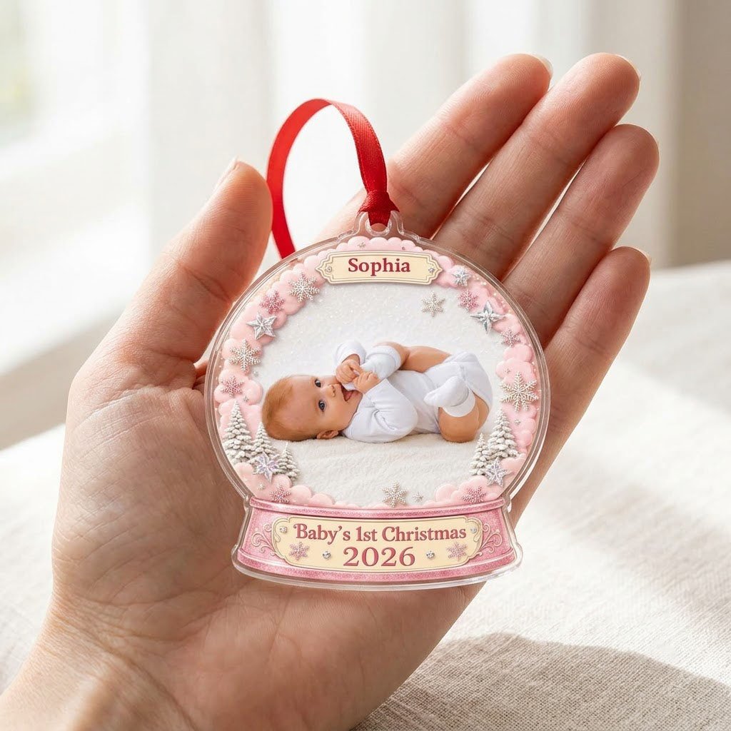 Pink snow globe acrylic ornament with "Baby's 1st Christmas", name banner, year base, and baby photo frame