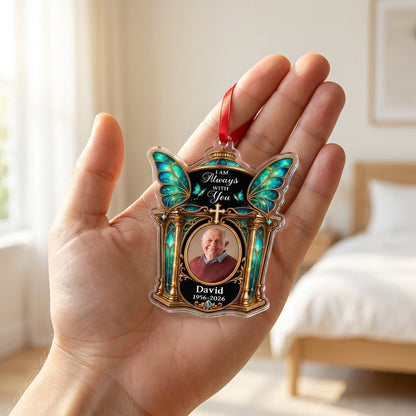 Clear acrylic ornament with winged shrine, teal butterfly wings, cross, oval photo, and 'I AM Always WITH You'.