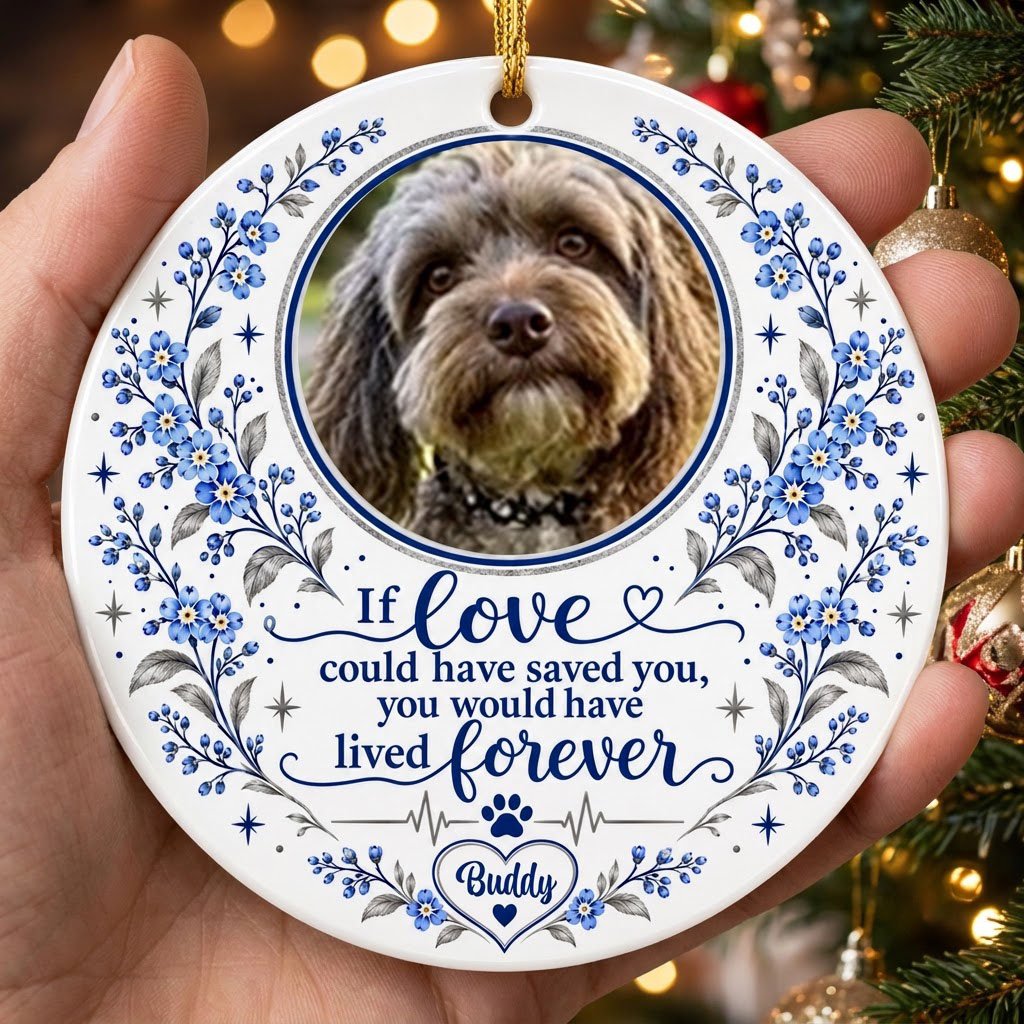 Round ceramic ornament with pet photo, blue forget-me-not florals, paw heartbeat line, and memorial quote.