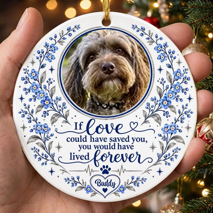 Round ceramic ornament with pet photo, blue forget-me-not florals, paw heartbeat line, and memorial quote.