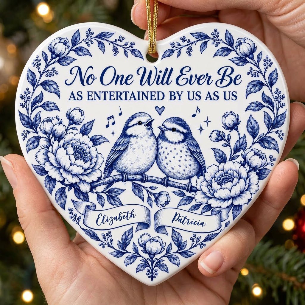 Heart ceramic ornament with two birds, blue floral frame, music notes above, and two name banners in cobalt.
