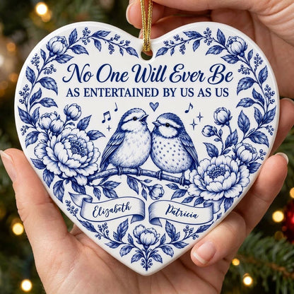 Heart ceramic ornament with two birds, blue floral frame, music notes above, and two name banners in cobalt.