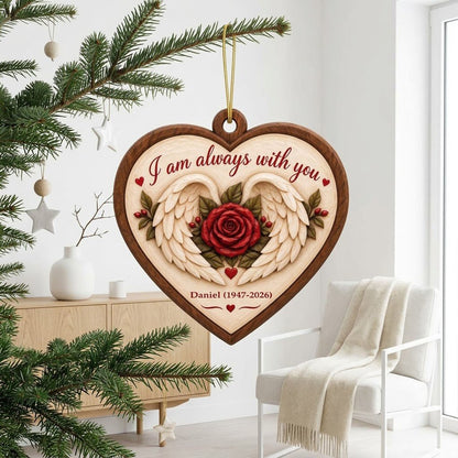 Heart-shaped wood ornament with angel wings around a red rose and the words 'I am always with you'.