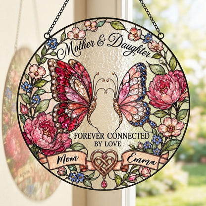 Round stained-glass style suncatcher with two butterflies, pink peonies and a ribbon banner for Mother & Daughter.