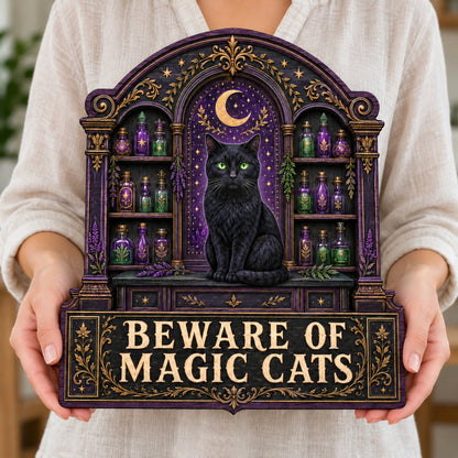 Arched wooden sign with a black cat, crescent moon, night sky, and potion shelves reading Beware of Magic Cats.
