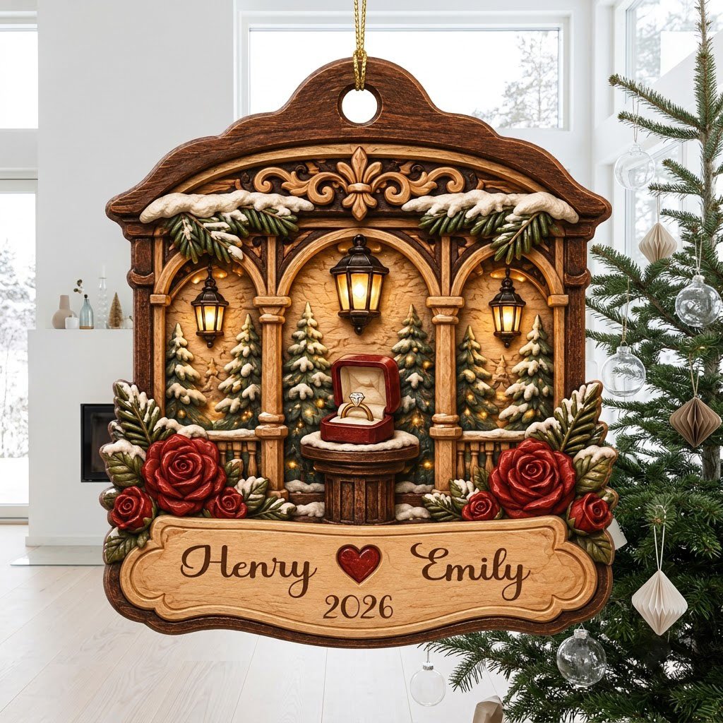 Arched wood ornament with three lanterns, pine trees, red roses, and an open ring box on a central pedestal.