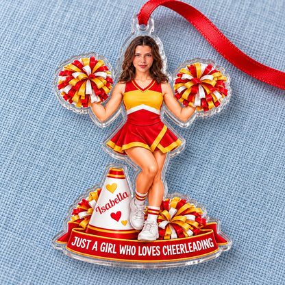 Custom-cut acrylic ornament of a cheerleader in red and yellow with pom-poms, a white megaphone, and a red name banner