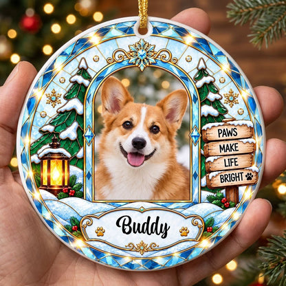 Round ceramic ornament with blue and gold stained-glass border, dog photo center, snow tree, gold lantern, holly, signpo