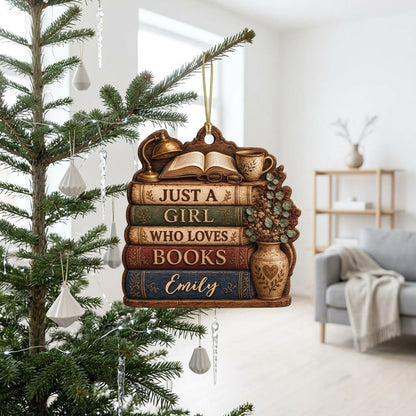 Bookshelf-shaped wood ornament with lamp, open book, teacup, vase, and Just a Girl Who Loves Books text.