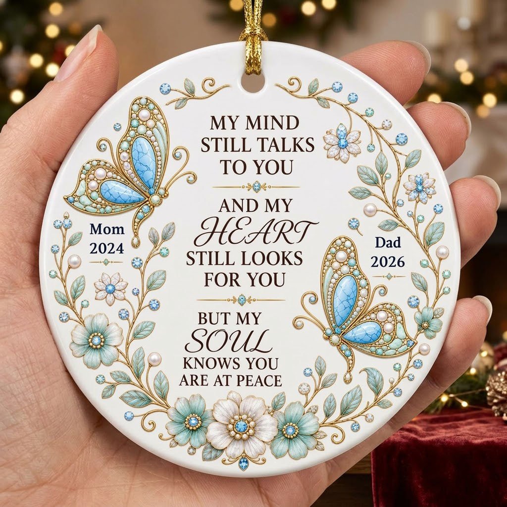 White round ornament with jeweled butterflies, floral wreath, and memorial quote with personalized name and year.