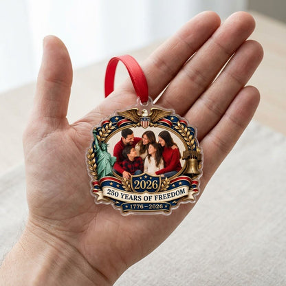Ornate scalloped acrylic ornament with eagle, Statue of Liberty, Liberty Bell and an oval family photo frame.