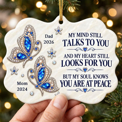 Scalloped ceramic ornament with two blue jeweled butterflies, silver starburst flowers and a memorial quote.