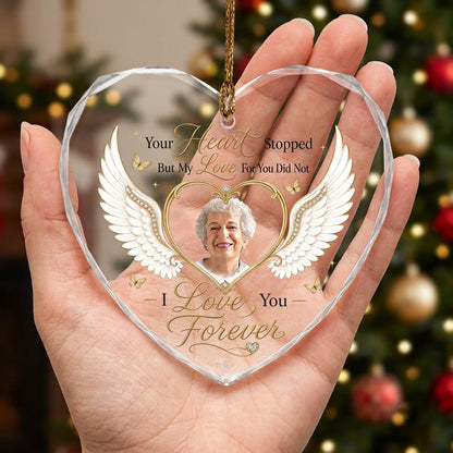 Heart-shaped glass ornament with white angel wings, gold heart photo frame, golden butterflies and sparkles.