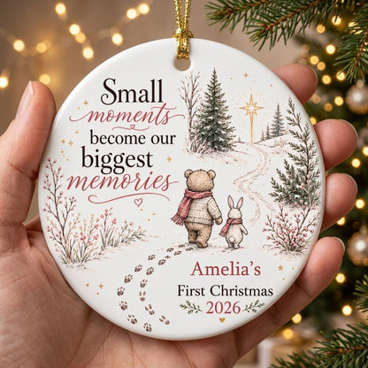 Round ceramic ornament with bear and bunny in scarves on snowy path, trees, star, quote, and personalized name and year.