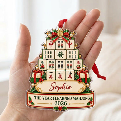 Acrylic tree ornament of mahjong tiles with bow, stars, holly, pearls, and two cream banners for name and year.
