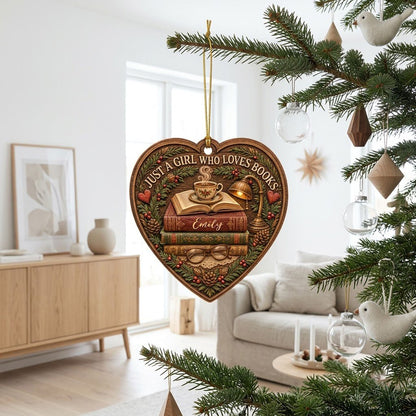 Heart-shaped wood ornament with books, open book and teacup, lamp, glasses, pine foliage, pinecones and hearts.
