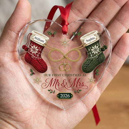 Heart glass ornament with red and green knit stockings, gold infinity loop with rings, Mr & Mrs text, names and date.