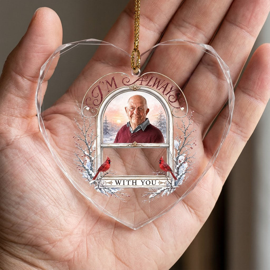 Heart-shaped glass ornament with red cardinals, arched photo window, and I'M ALWAYS WITH YOU text on a snowy winter scen