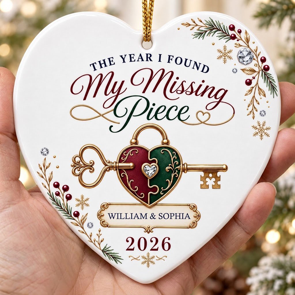 Heart ceramic ornament with a gold key through a burgundy and green heart lock, pine sprigs, berries, and gold snowflake