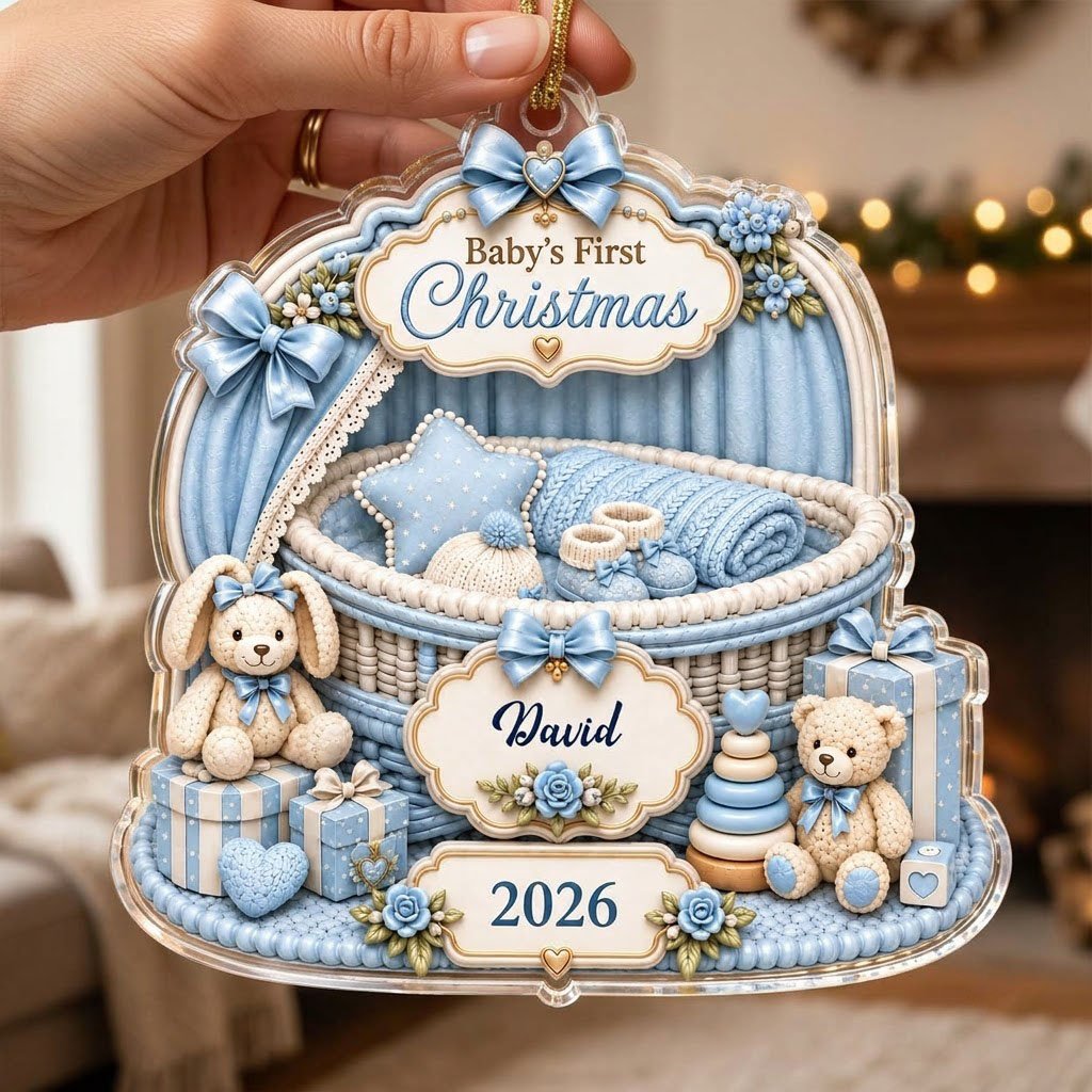 Clear acrylic ornament with blue nursery bassinet, bunny, teddy, and Baby's First Christmas with name and year.