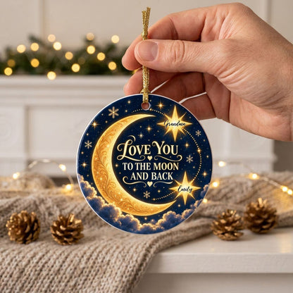 Round ceramic ornament with golden crescent moon, navy sky, stars, and 'LOVE YOU TO THE MOON AND BACK'.