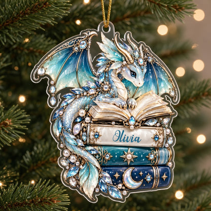 Custom-cut acrylic ornament of a jeweled blue dragon on stacked books with a red ribbon and a personalized name.