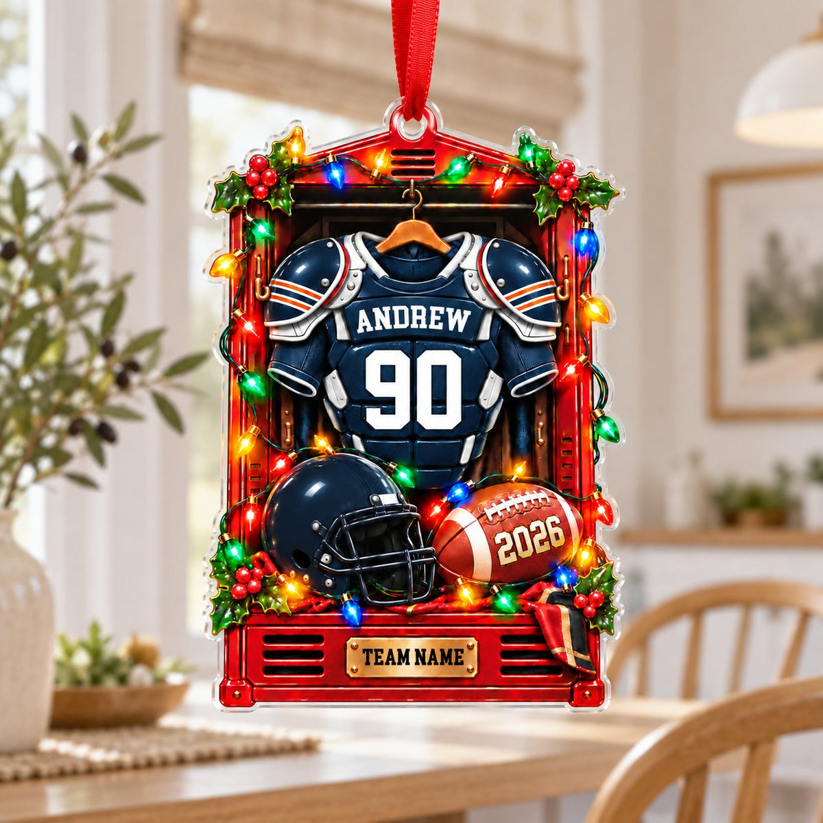 A red sports locker ornament with a football jersey, helmet, ball, holly, and Christmas lights on a custom-cut acrylic s