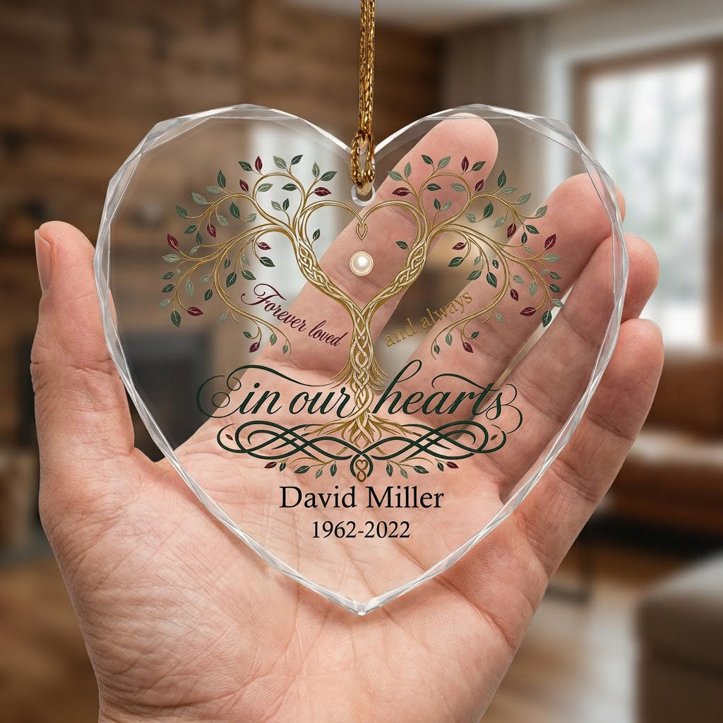 Heart glass ornament with a golden tree of life and the text 'Forever loved and always in our hearts'.