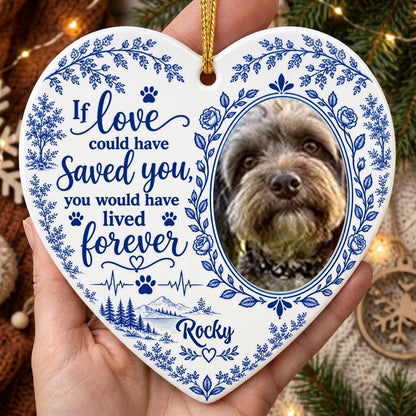 White heart ceramic ornament with blue dog photo frame wreath, memorial quote, paw heartbeat, and a mountain lake scene.