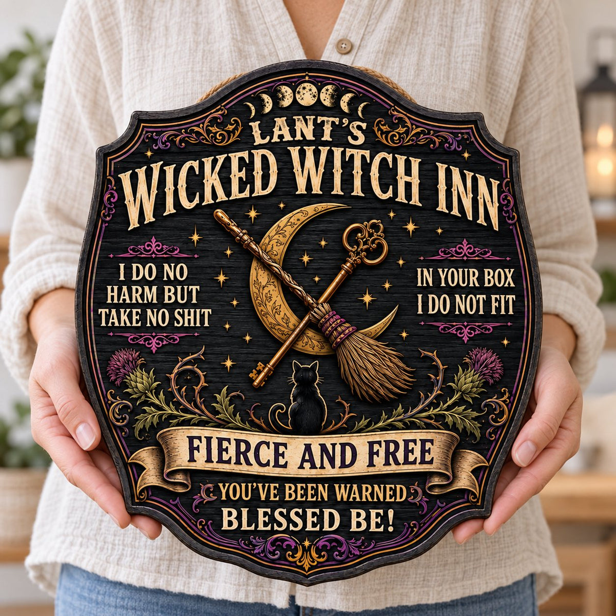 Ornate wooden plaque with moon phases, crescent moon, broomstick, key, black cat, thistles and witchy quotes.