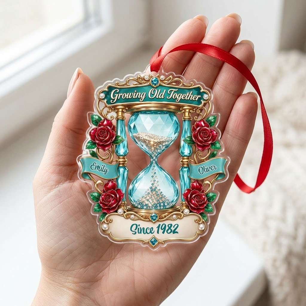 Custom-cut acrylic ornament with jeweled hourglass, red roses, and the words 'Growing Old Together'.