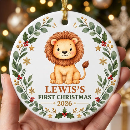 Round ceramic ornament with a cute crowned lion inside a festive wreath of green leaves, red berries, stars and snowflak