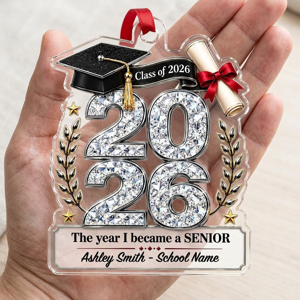 Custom-cut clear acrylic ornament shaped like a graduation cap with Class of 2026, diploma, laurels, and name plaque.