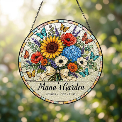 Round stained-glass style suncatcher with floral bouquet, butterflies, and 'Mana's Garden' with names.