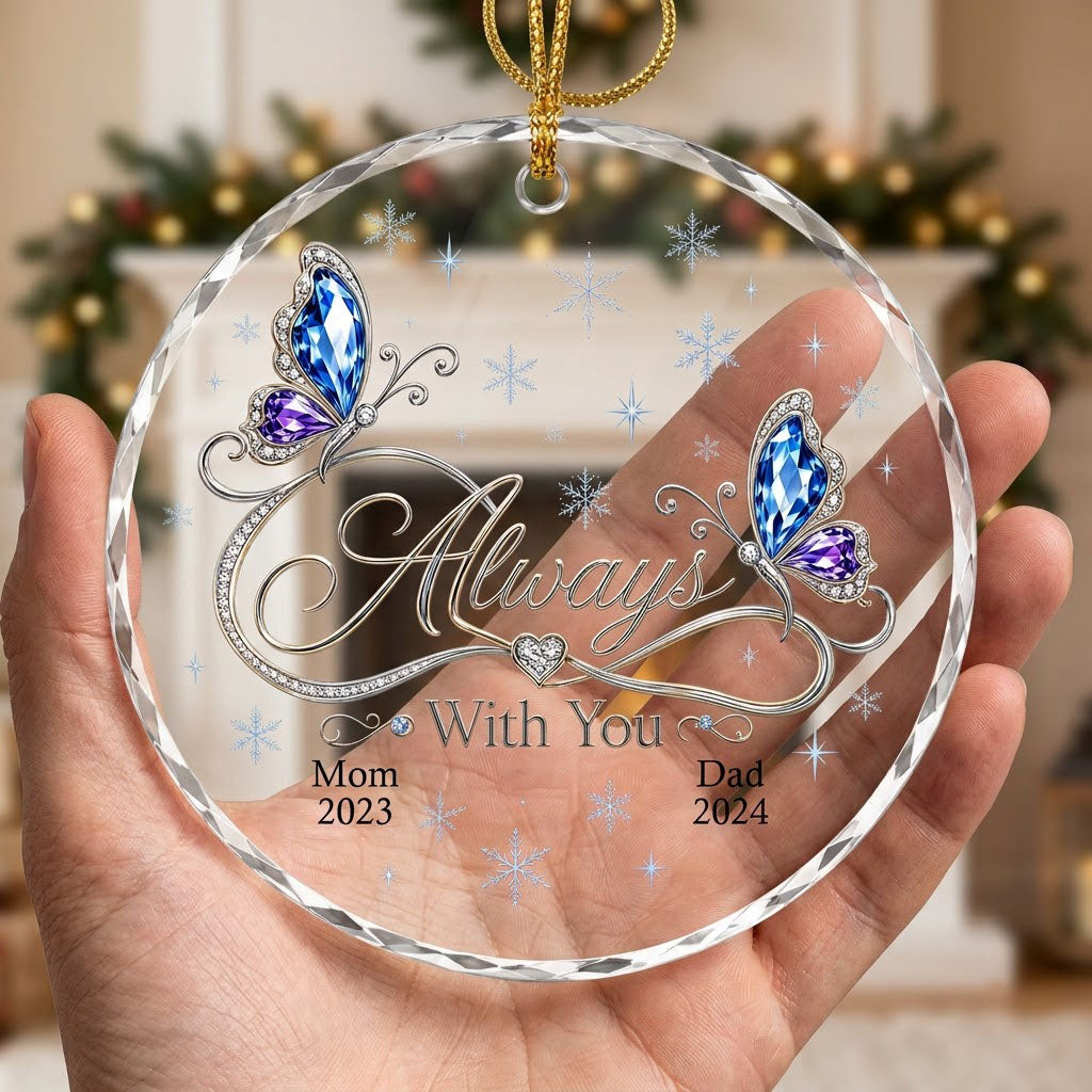 Round glass ornament with blue and purple jeweled butterflies, silver infinity heart, and light blue snowflakes.