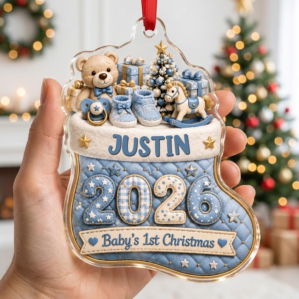 Blue quilted stocking ornament with teddy bear, baby toys, Baby's 1st Christmas text, and name and year.