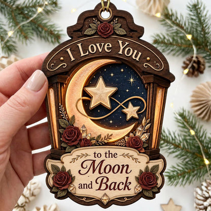Wood ornament with red roses, crescent moon and stars on a night sky, and the phrase I Love You to the Moon and Back.