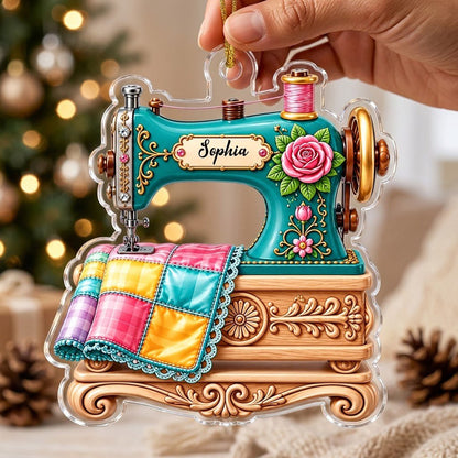 Custom-cut acrylic ornament of a teal vintage sewing machine with a rose and quilt block, personalized with a name.