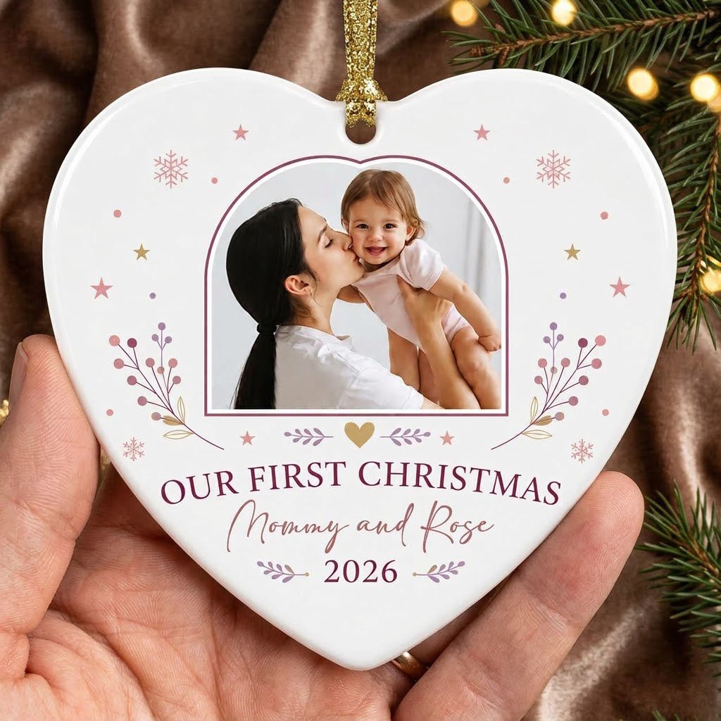 Heart ceramic ornament with “OUR FIRST CHRISTMAS”, arch photo frame, stars, snowflakes, berry sprigs, leafy flourishes, 
