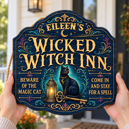 Custom-cut wooden sign with black cat, glowing lantern, golden key, crescent moons, stars, and Wicked Witch Inn text