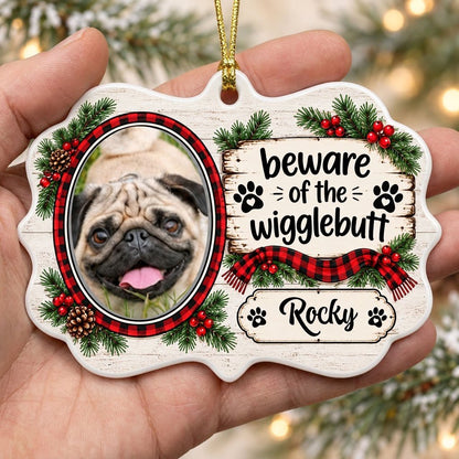 Medallion ornament with buffalo plaid dog photo frame, evergreens, and 'beware of the wigglebutt' text